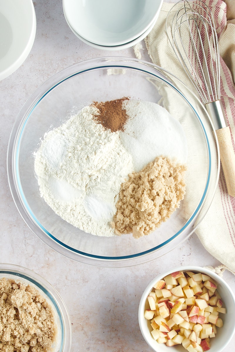 overhead view of dry ingredients for muffins in a glass mixing bowl