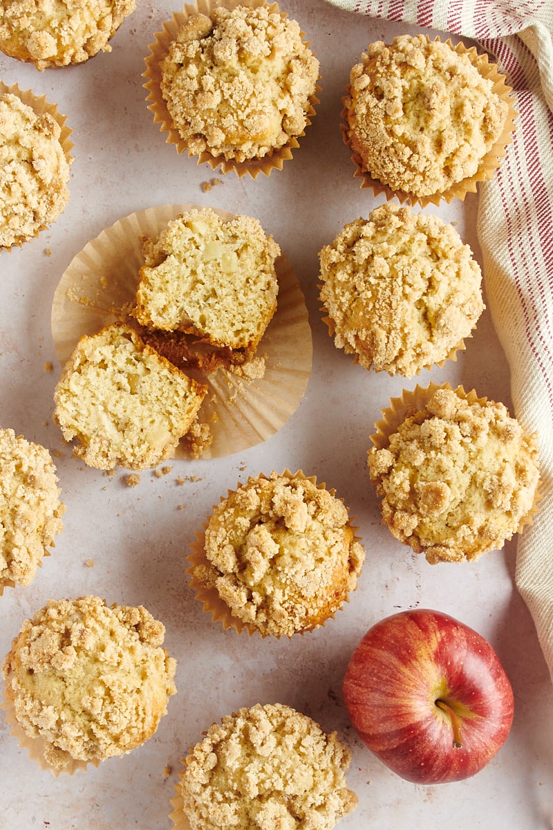 overhead view of Apple Cinnamon Muffins scattered over a countertop