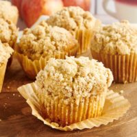 Apple Cinnamon Muffins on a wooden surface