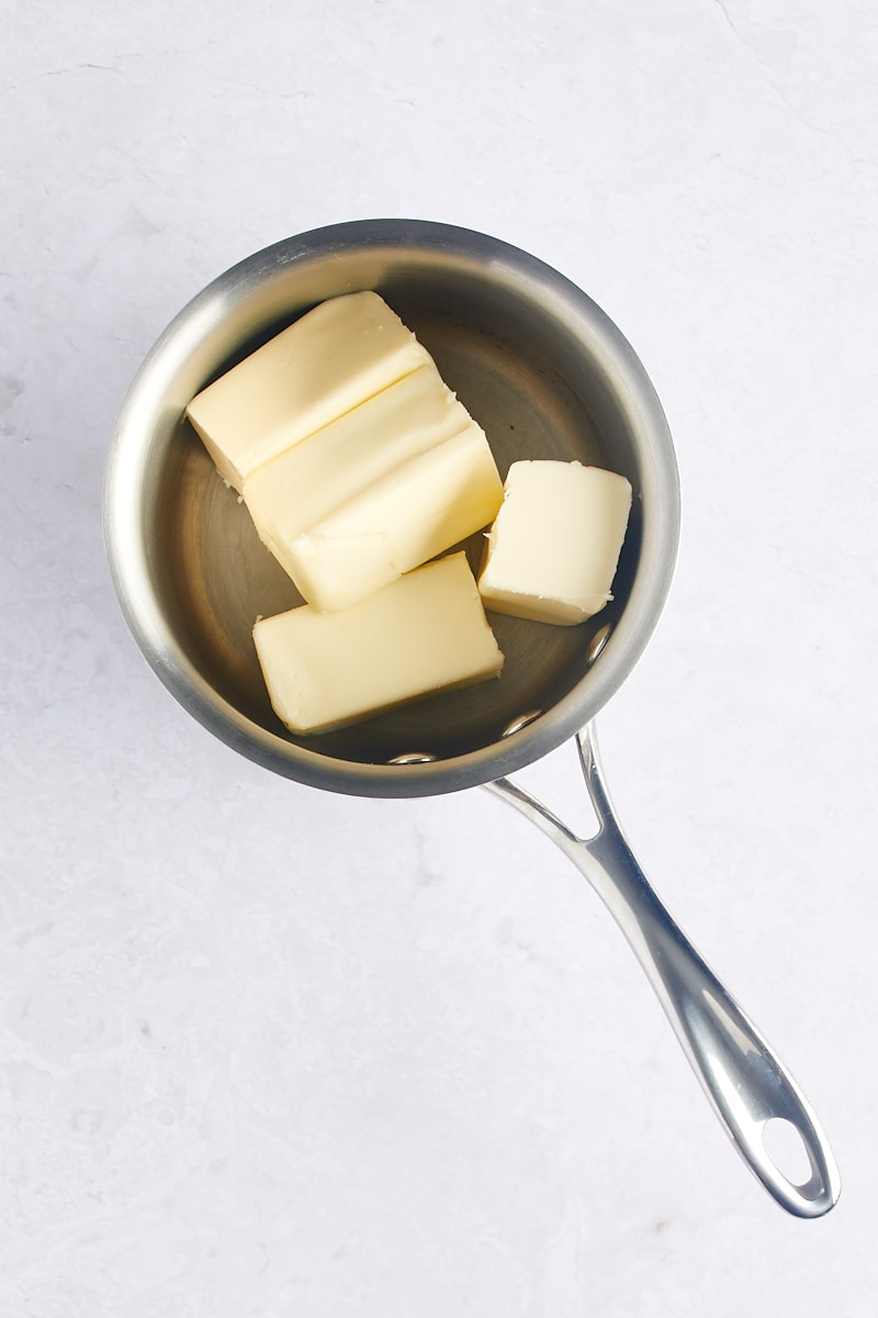 Chopped butter in the bottom of a saucepan.