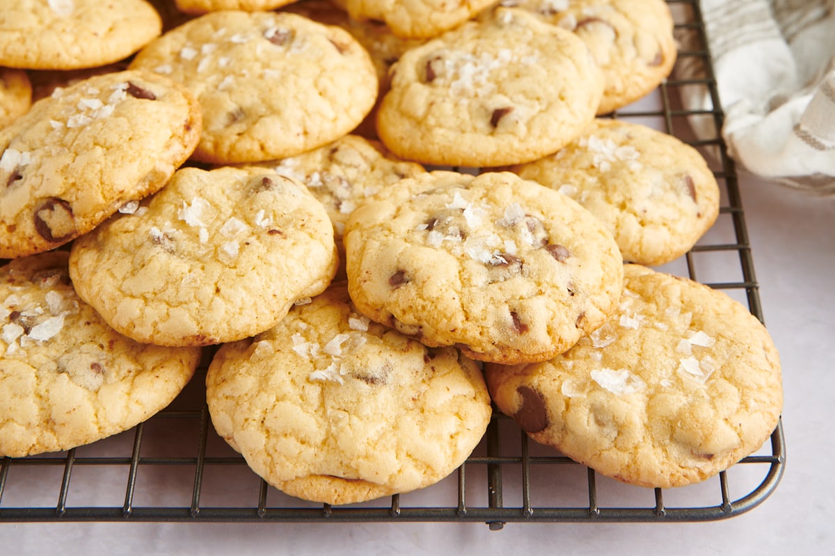 A cooling rack piled high with salted cookies.
