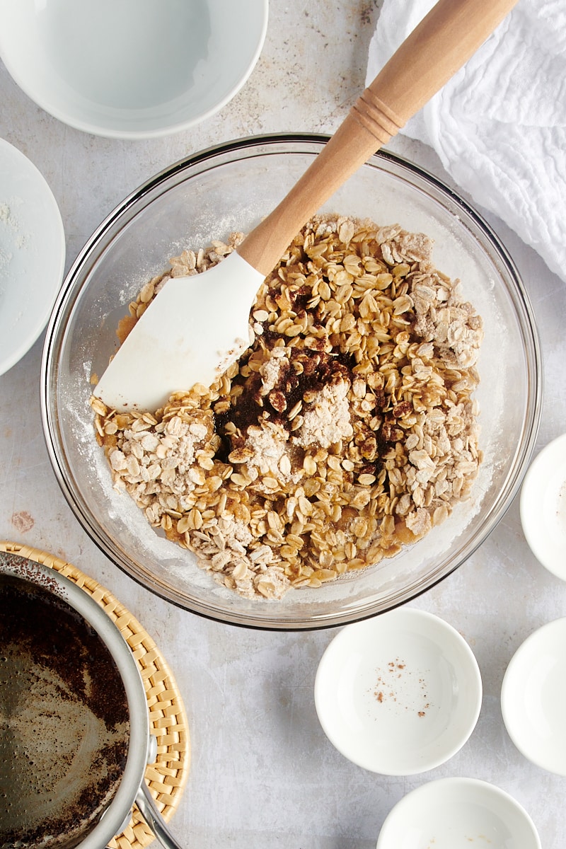 overhead view of brown butter added to oat mixture for Brown Butter Pear Crisp