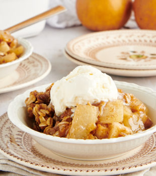 bowl of Brown Butter Pear Crisp topped with ice cream