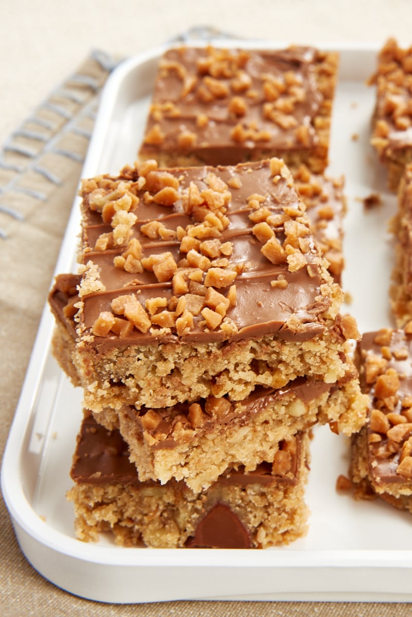 stack of Chocolate Toffee Bars on a white tray