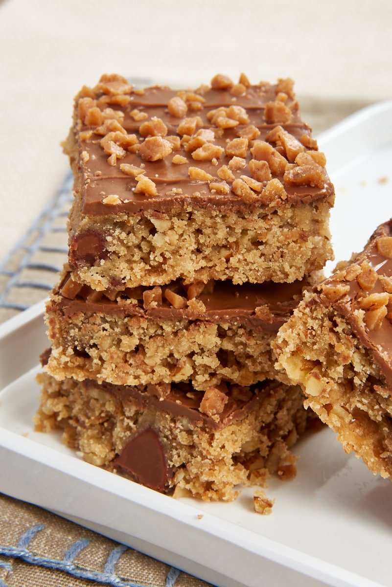 three Chocolate Toffee Bars stacked on a white tray