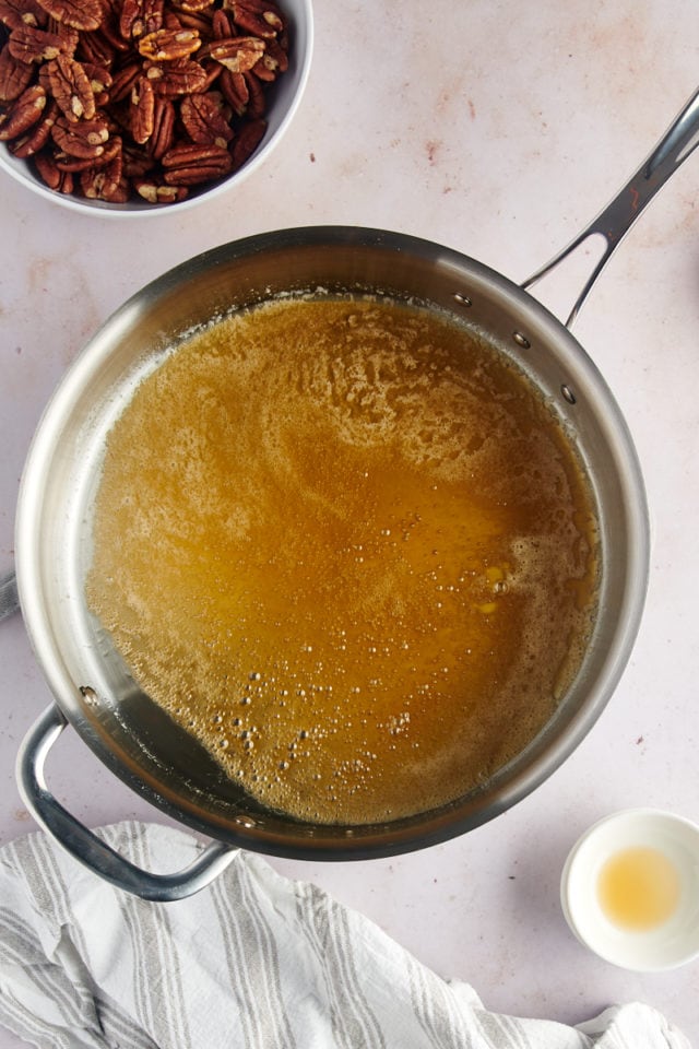 overhead view of glaze mixture for Glazed Pecans in a skillet