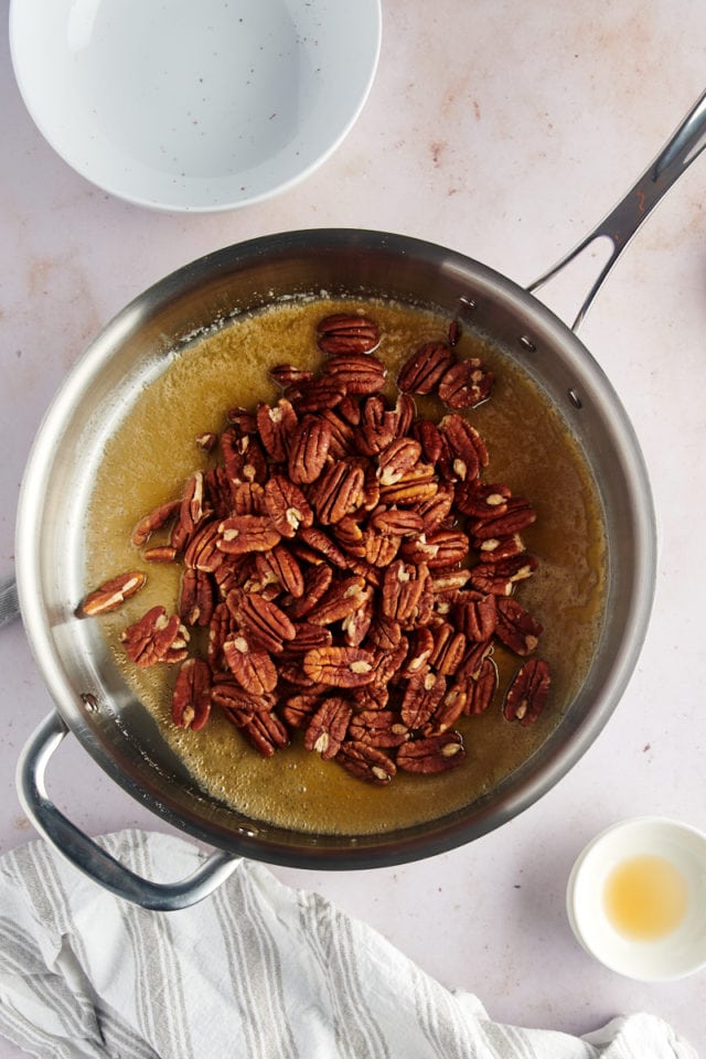 overhead view of pecans added to glaze mixture for Glazed Pecans