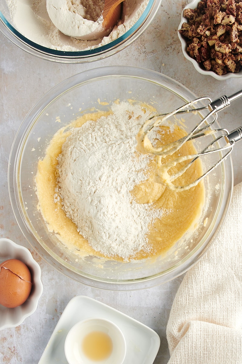 overhead view of dry ingredients added to wet ingredients for Maple Pecan Cookies