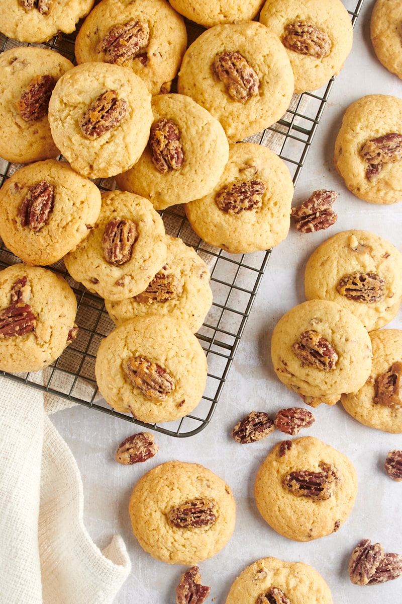 overhead view of Maple Pecan Cookies on a wire rack and a countertop