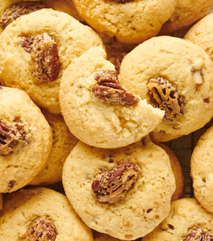 overhead view of a crowded pile of Maple Pecan Cookies