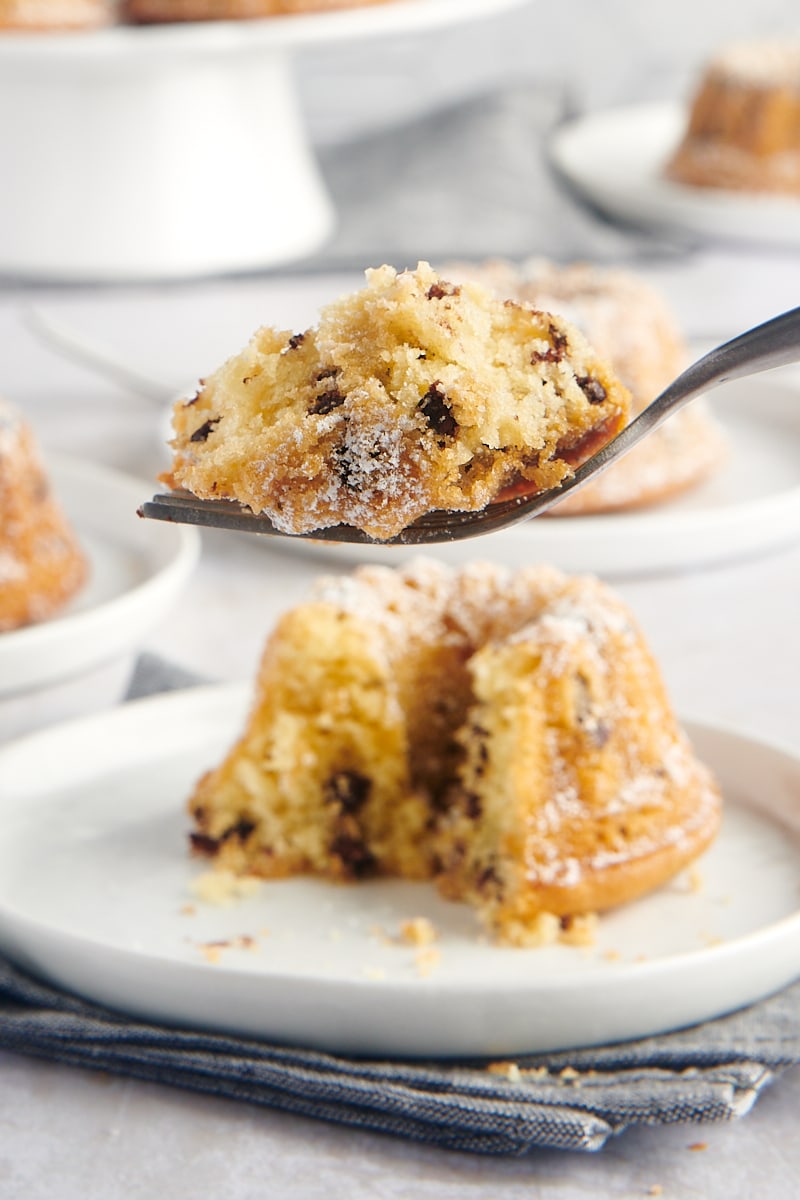 a bite of Mini Chocolate Chip Bundt Cake on a fork with remaining cake in the background