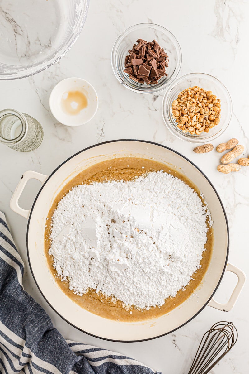 Adding confectioners sugar to butter mixture