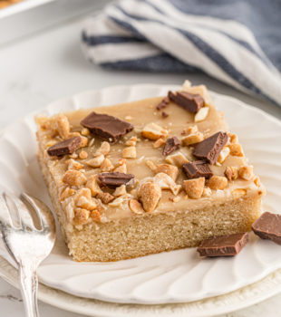 A slice of Texas Sheet cake on a plate with a fork.