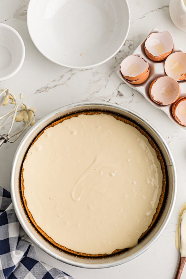 Adding the cheesecake layer to the pie.