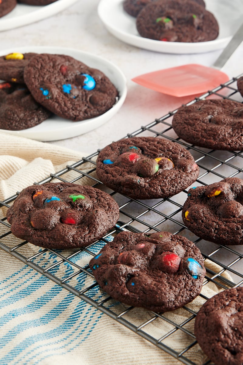 Chocolate M&M Cookies on a wire cooling rack