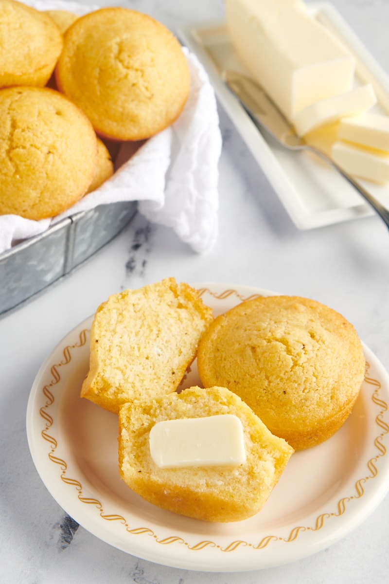 Corn muffins cut with a pat of butter.
