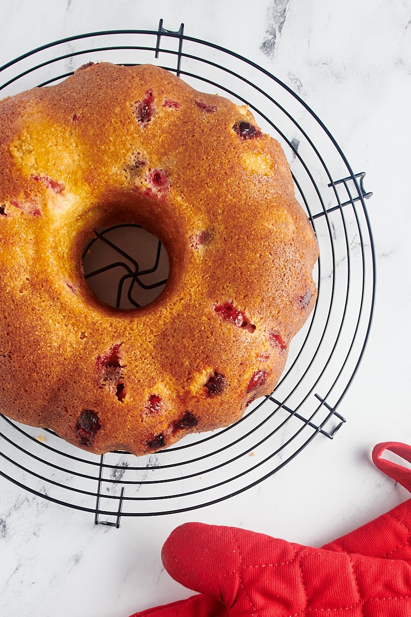Cranberry bundt cake cooling on a wire rack