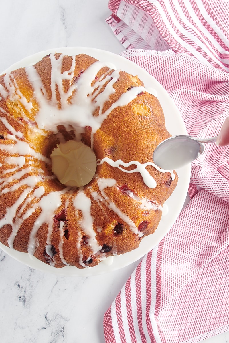 Glazing the cranberry bundt cake