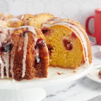 Cranberry bundt cake with a slice missing