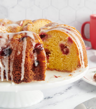 Cranberry bundt cake with a slice missing