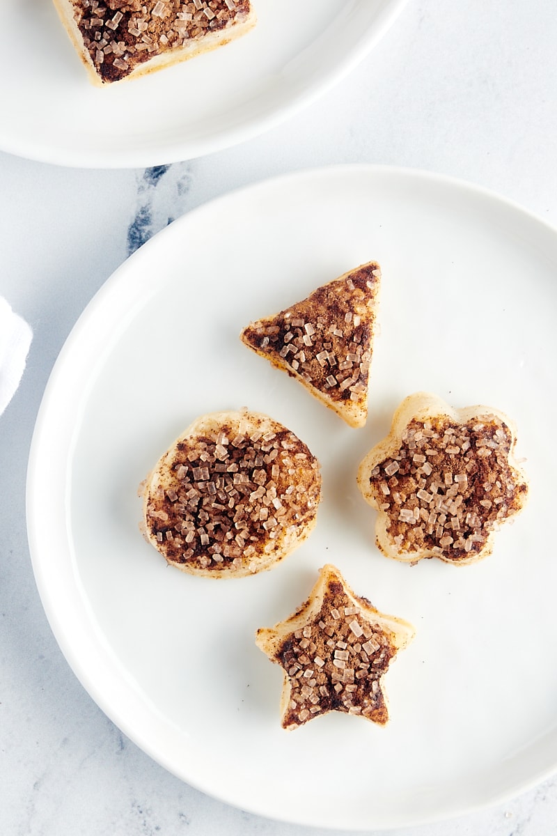 overhead view of four Pie Crust Cookies on a white plate