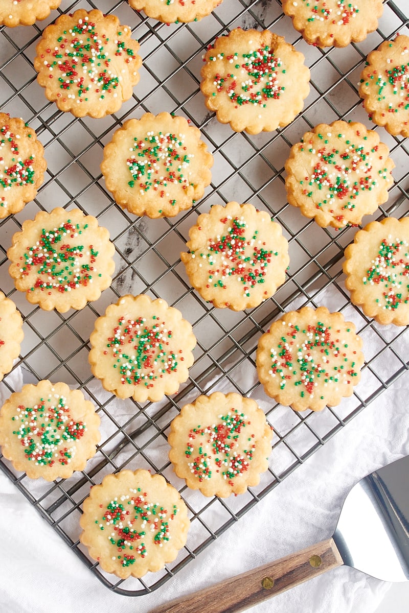 Overhead view of shortbread cookies cooling on a wire rack.