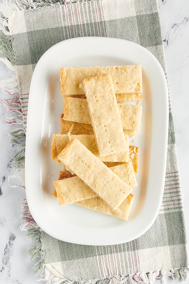 overhead view of bar-shaped shortbread on a white plate