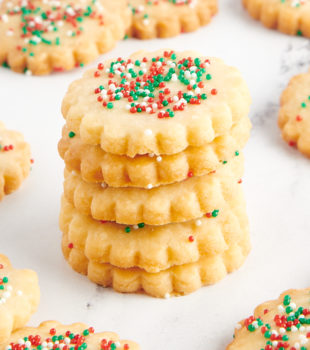 stack of shortbread cookies with more cookies surrounding them