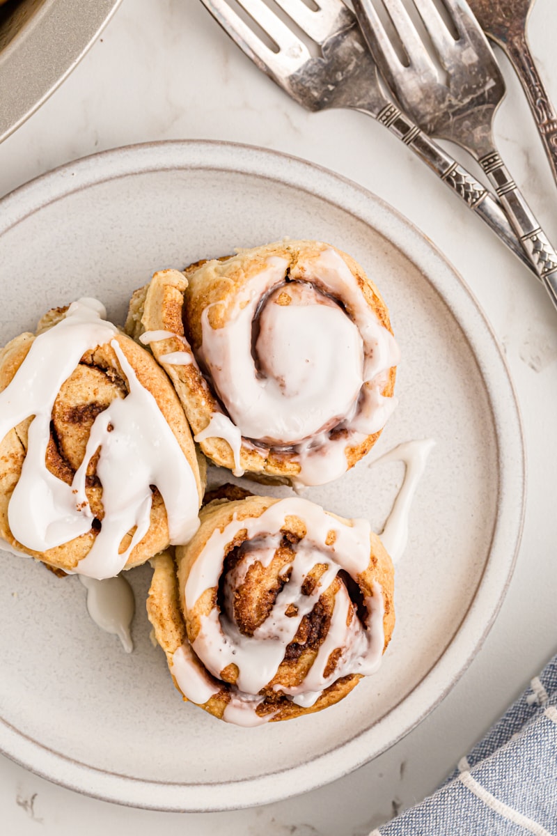 overhead view of three Biscuit Cinnamon Rolls on a white plate