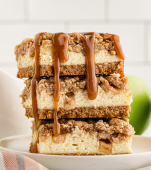 stack of three Caramel Apple Cheesecake Bars on a white plate