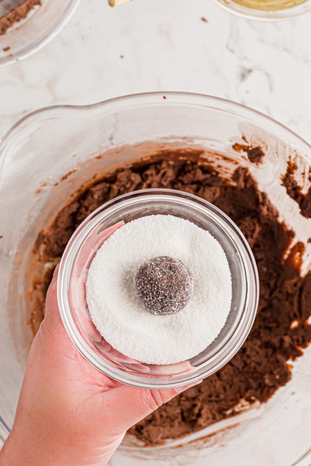 Double Chocolate Brownie Cookie dough ball in bowl of sugar