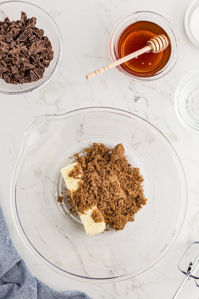 Overhead view of butter and sugar in mixing bowl