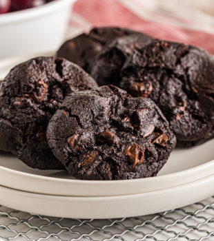 Double Dark Chocolate Cherry Cookies on two stacked white plates