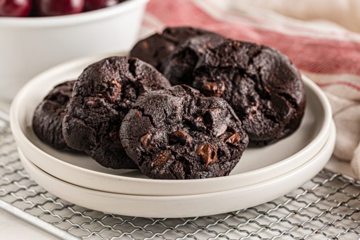 Double Dark Chocolate Cherry Cookies on two stacked white plates