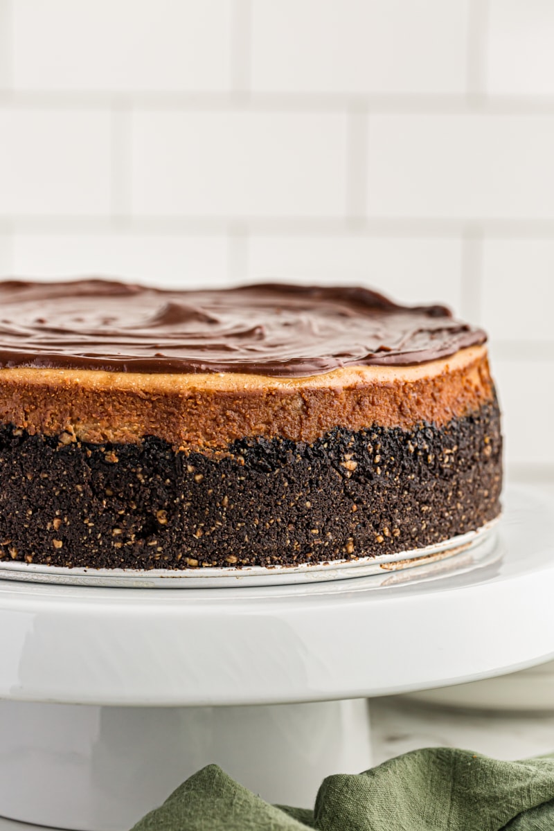 Peanut Butter Cup Cheesecake on cake stand