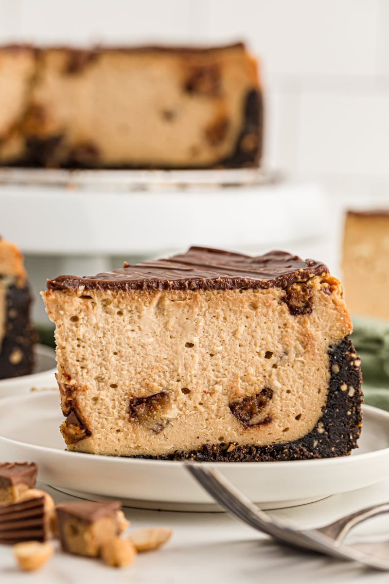 Side view of Peanut Butter Cup Cheesecake slice on plate