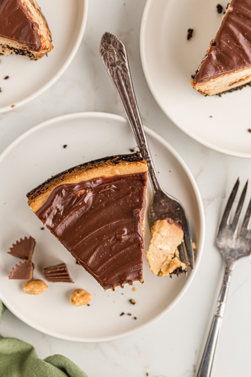 Overhead view of Peanut Butter Cup Cheesecake on plate with tip on fork