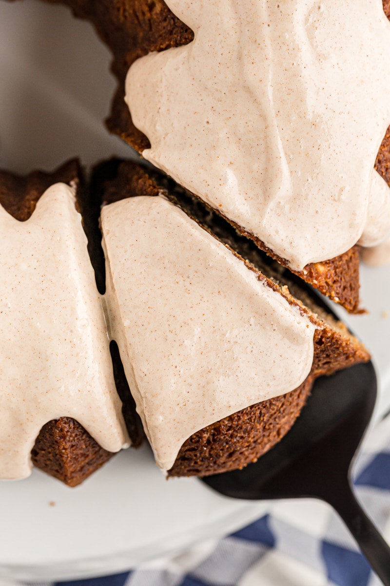 Cutting a slice of spiced pear cake