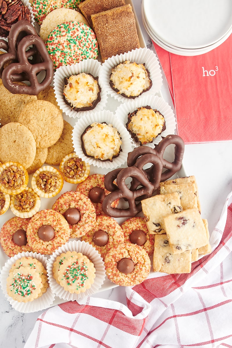 overhead view of a Christmas cookie tray filled with different kinds of cookies and sweet treats