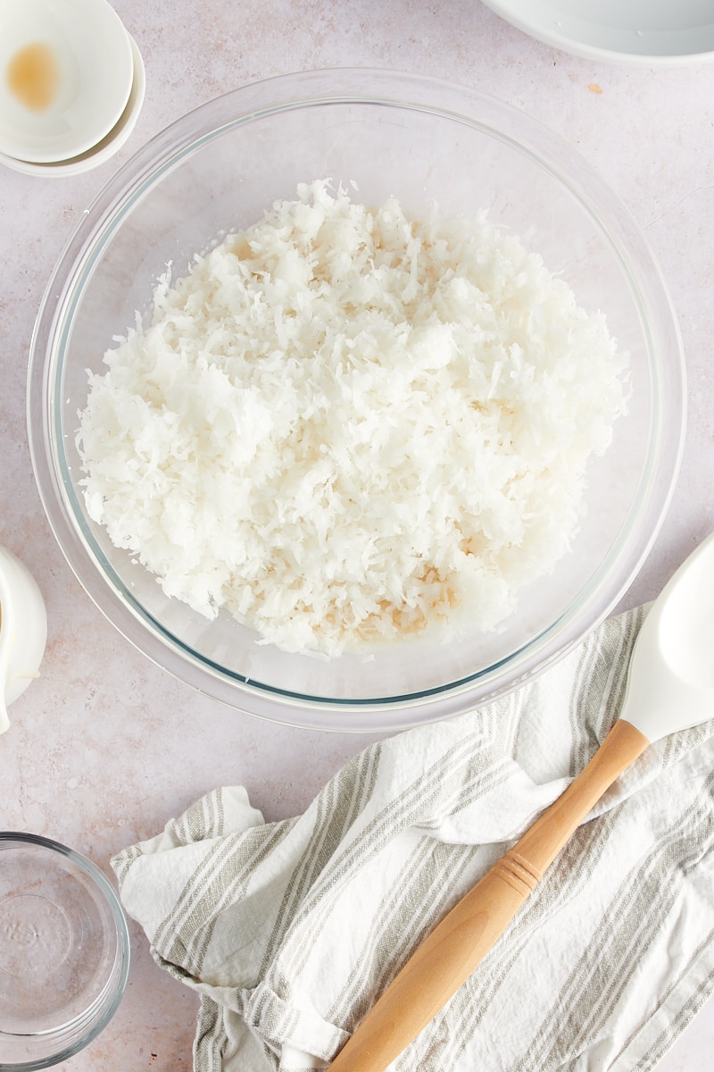 overhead view of coconut added to batter for Coconut Macaroons