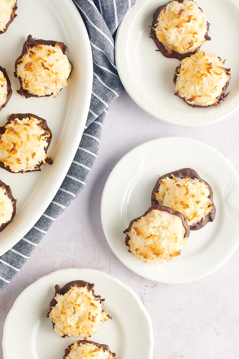 overhead view of Coconut Macaroons on small white plates and a large white tray