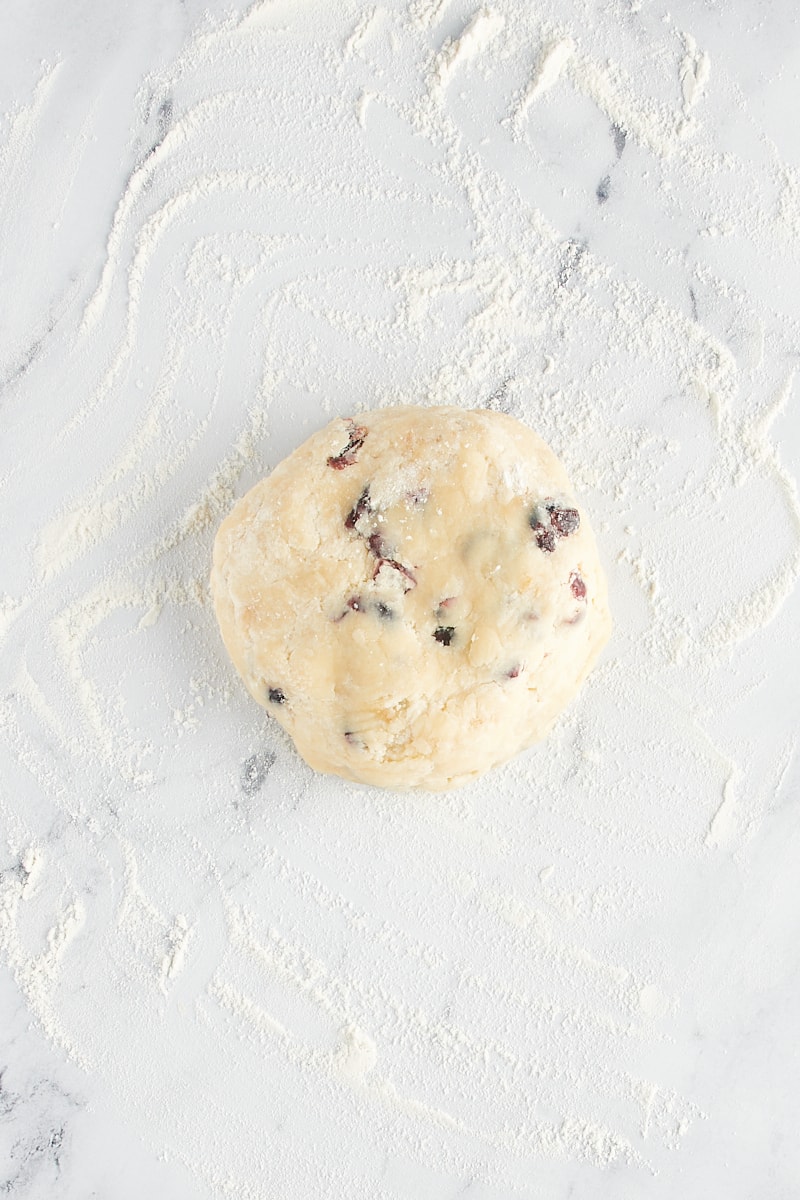 overhead view of Cranberry Shortbread Cookie dough on a lightly floured surface