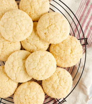 overhead view of drop sugar cookies on a wire rack