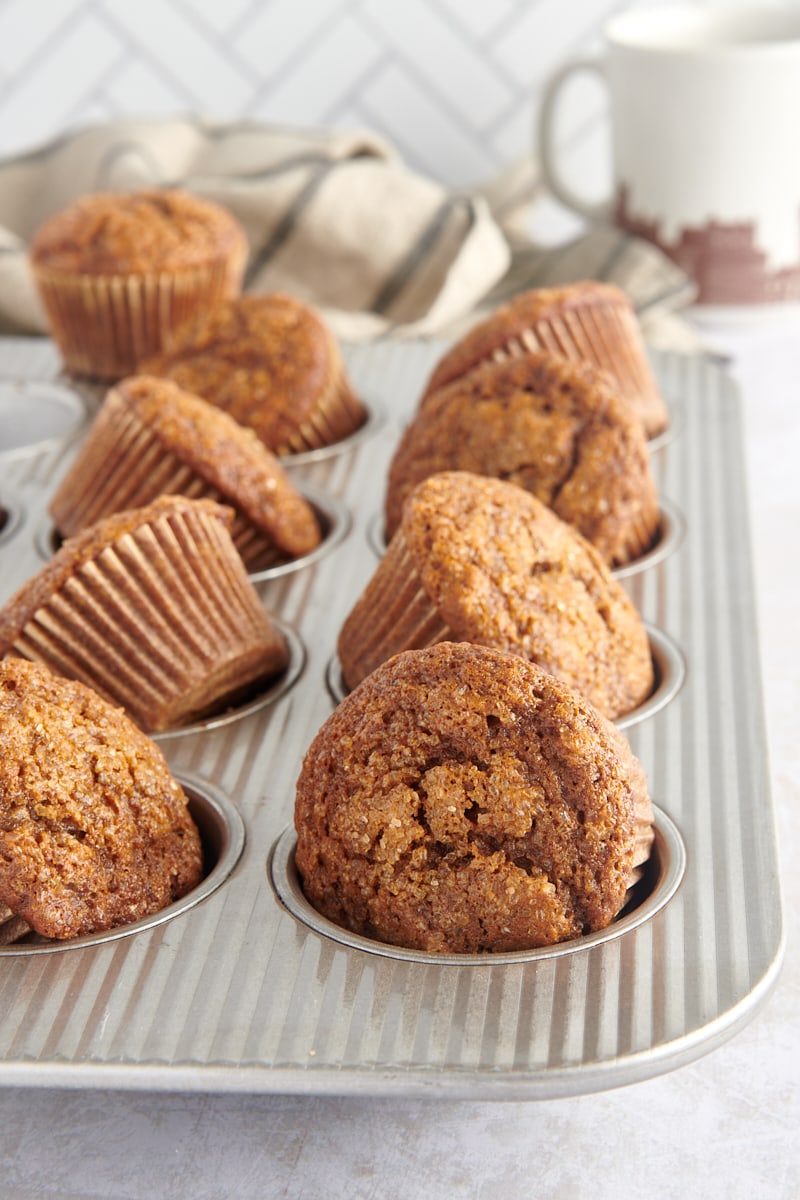Gingerbread Muffins partially removed from a muffin pan