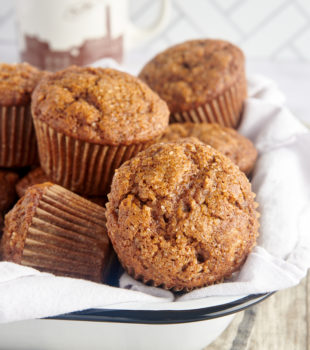 Gingerbread Muffins in a towel-lined white tray