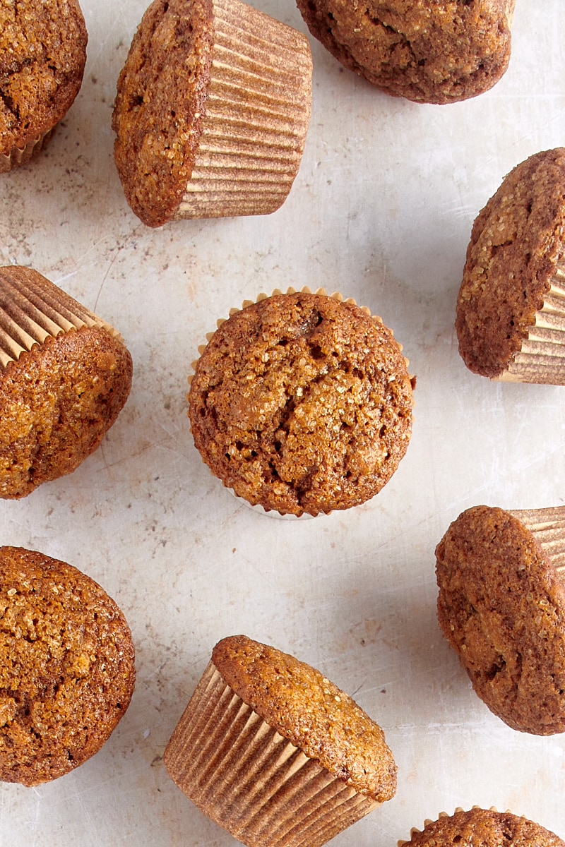 overhead view of Gingerbread Muffins scattered over a countertop