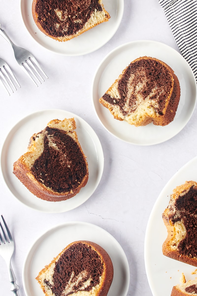 overhead view of slices of Marble Bundt Cake on white plates