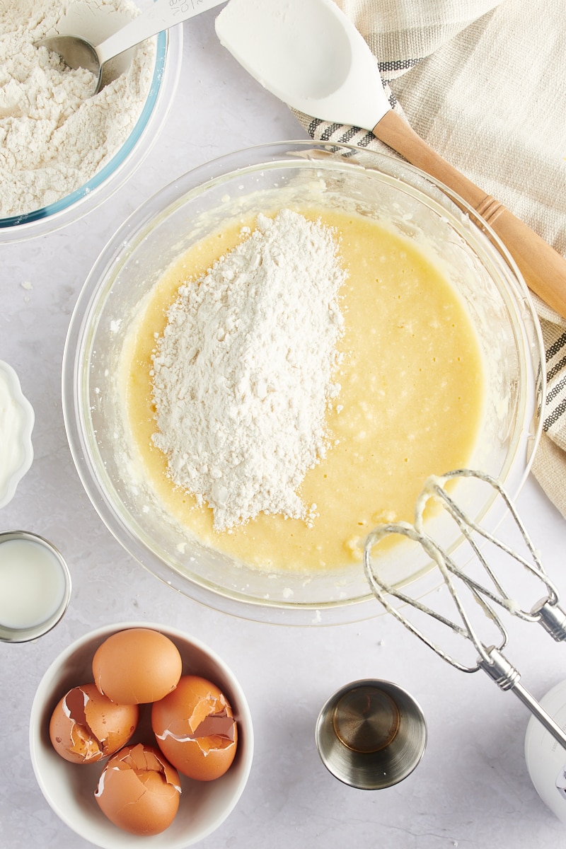 overhead view of flour mixture added to Marble Bundt Cake batter