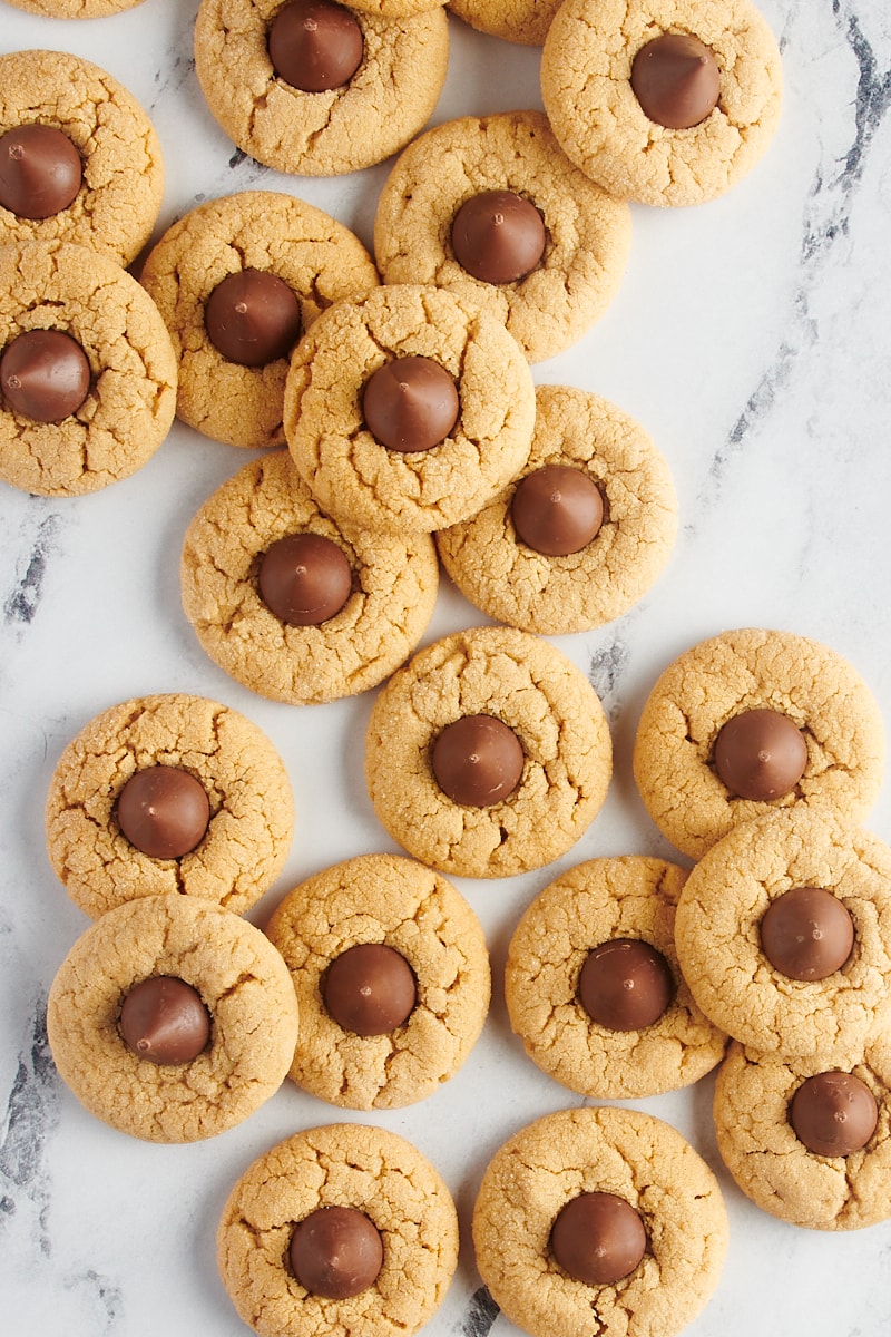 Peanut Butter Blossoms scattered over a marble surface