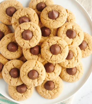 overhead view of Peanut Butter Blossoms piled on a large white tray